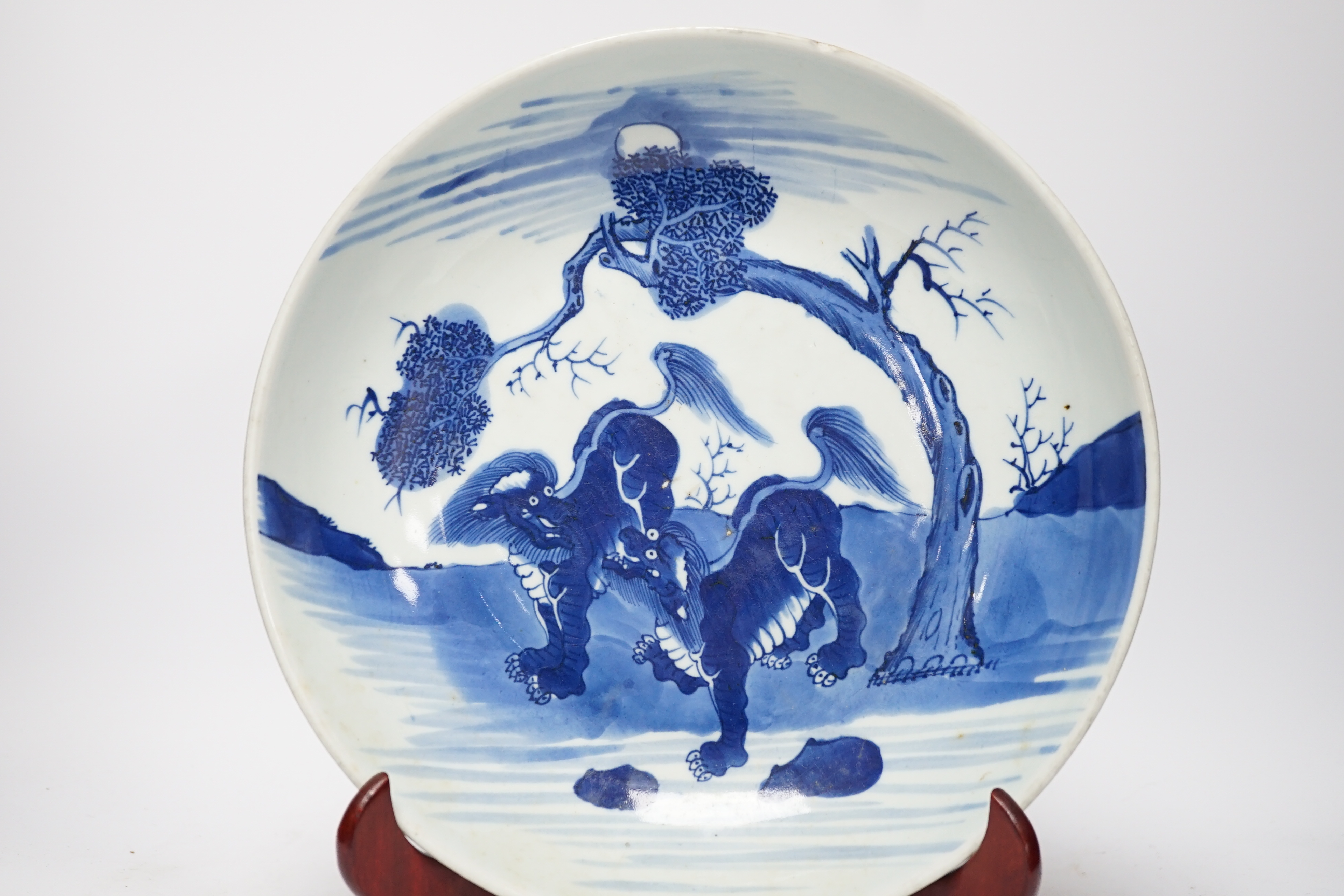 A large Chinese blue and white ‘mythical beasts’ saucer dish, Yongzheng period